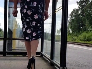 HannaTransa Chastity Crossdresser outdoors at train station.